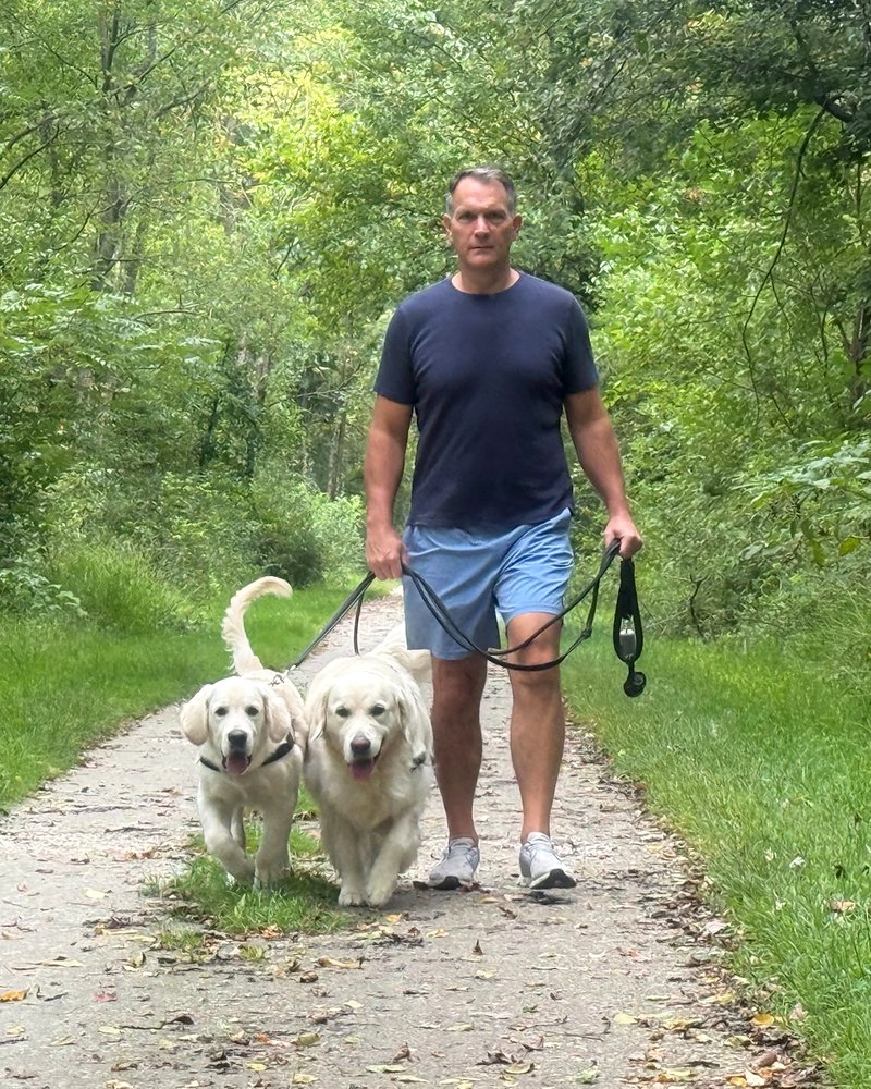 Trey walking Theo and Beau on the Turkey Trail near Freeland